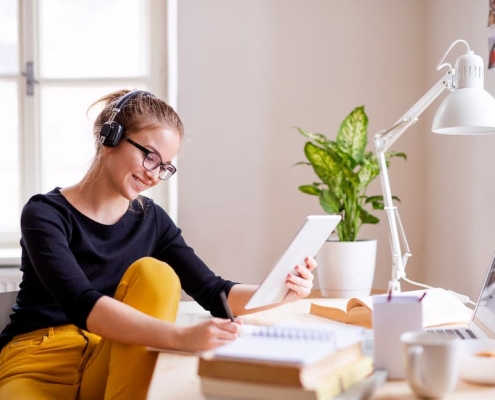 A writer busy in writing a script